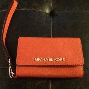 Brand new Michael Kors orange wristlet